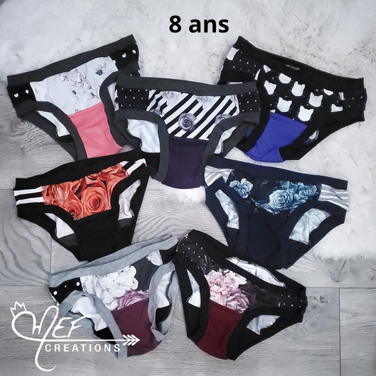 Culottes fille 8 ans, lot de 7, prêt-à-partir : fleuris gris, fleuris rayé diagonale, chat, fleuris rouge, fleuris marine, gros fleuris, fleuris plage